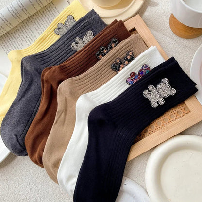 Paire de chaussettes ourson pailleté pliée