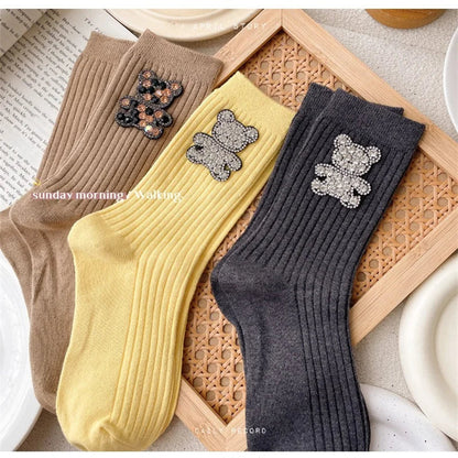 Détail du motif ourson scintillant sur chaussette
